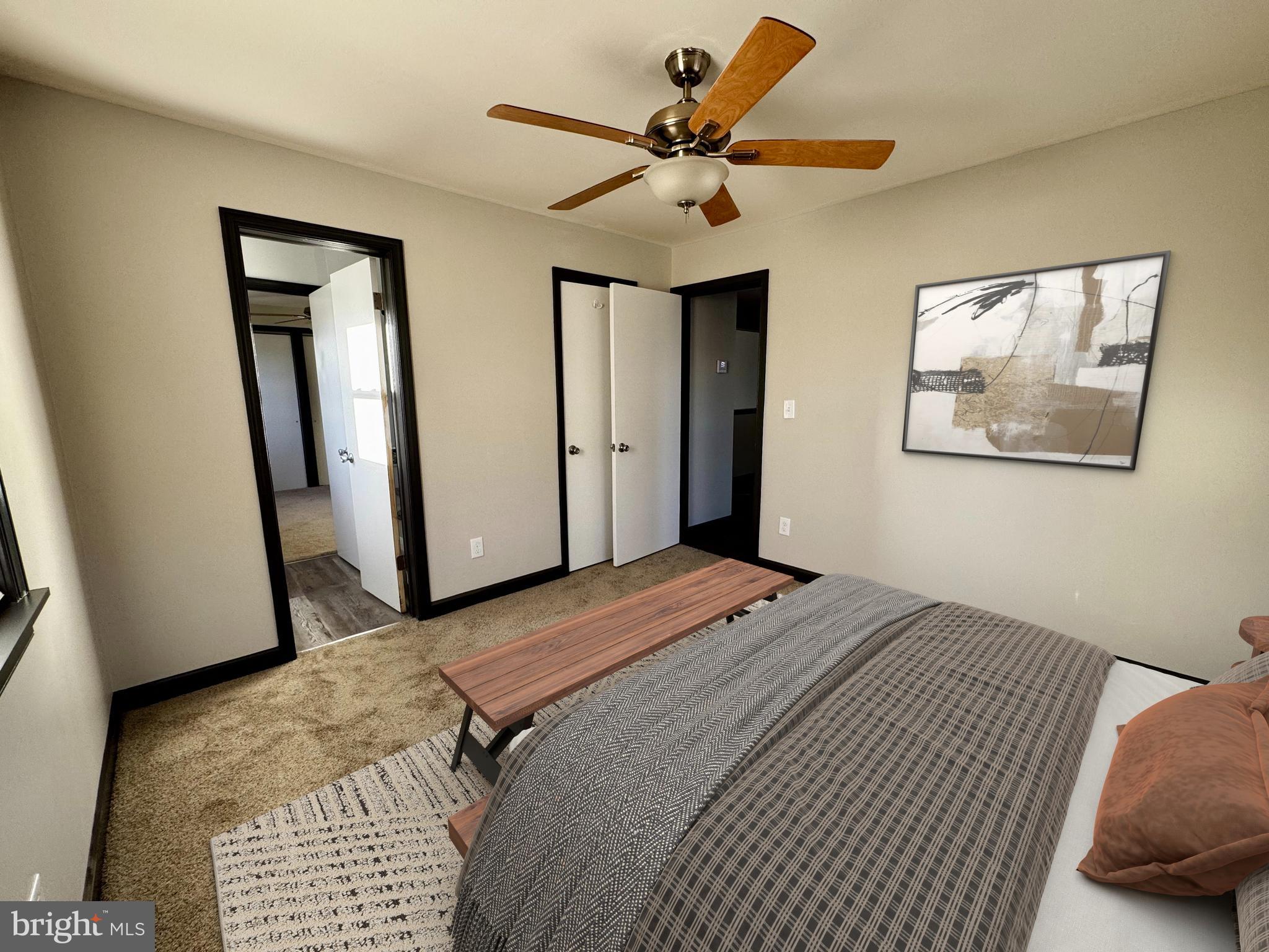 1708 Rita Road Dundalk, MD 21222 - Photo 7 of 16 a bedroom with a bed and a chandelier