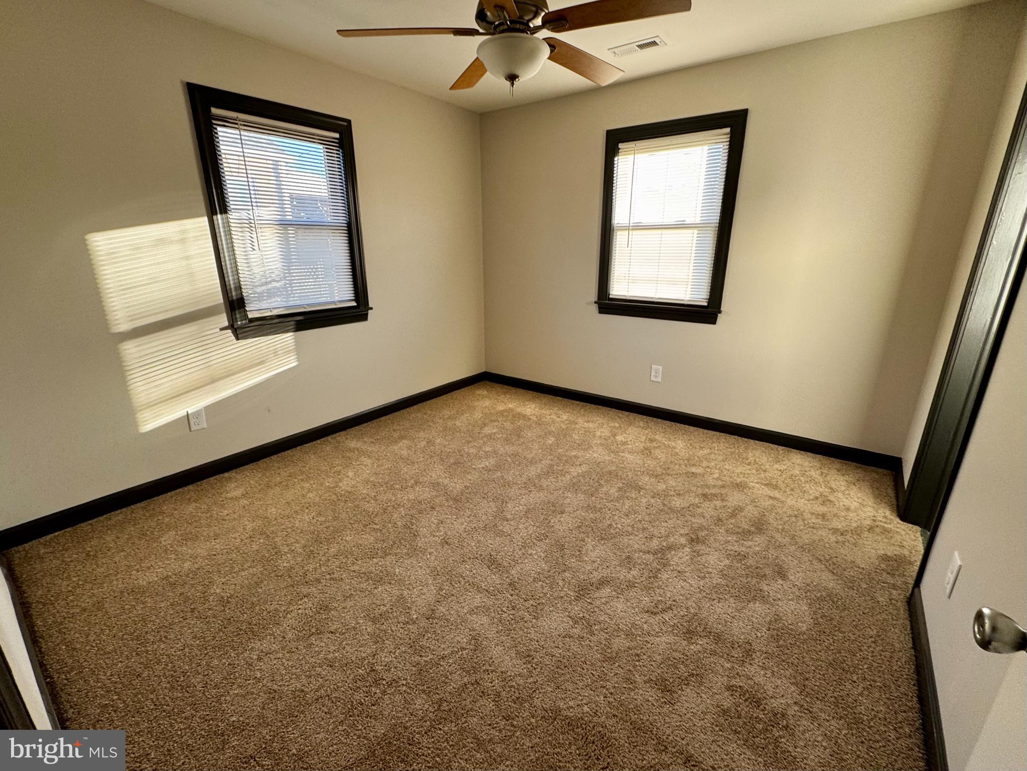 1708 Rita Road Dundalk, MD 21222 - Photo 8 of 16 an empty room with windows and cabinet
