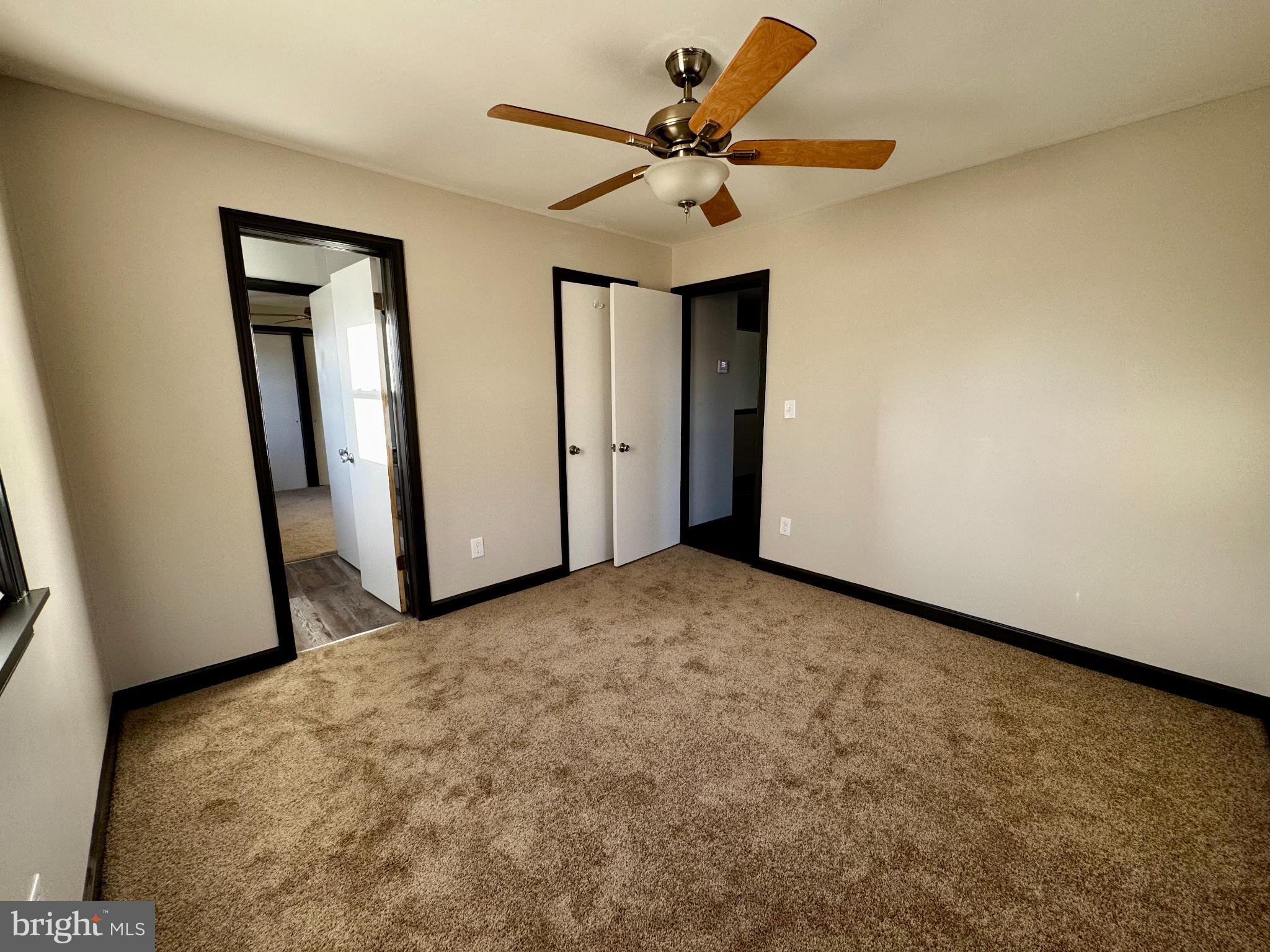 1708 Rita Road Dundalk, MD 21222 - Photo 9 of 16 a view of a livingroom with a ceiling fan and a rug
