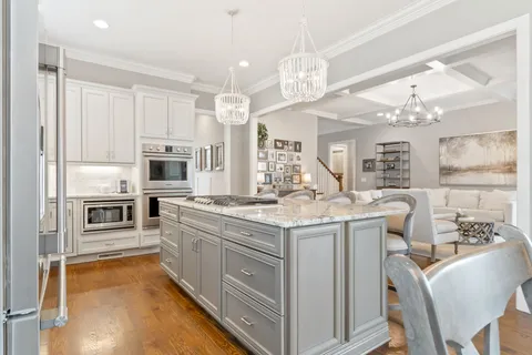 a living room with furniture a table and decor