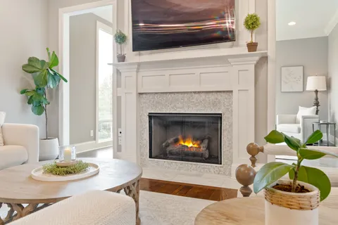 a bathroom with a granite countertop sink mirror and cabinets