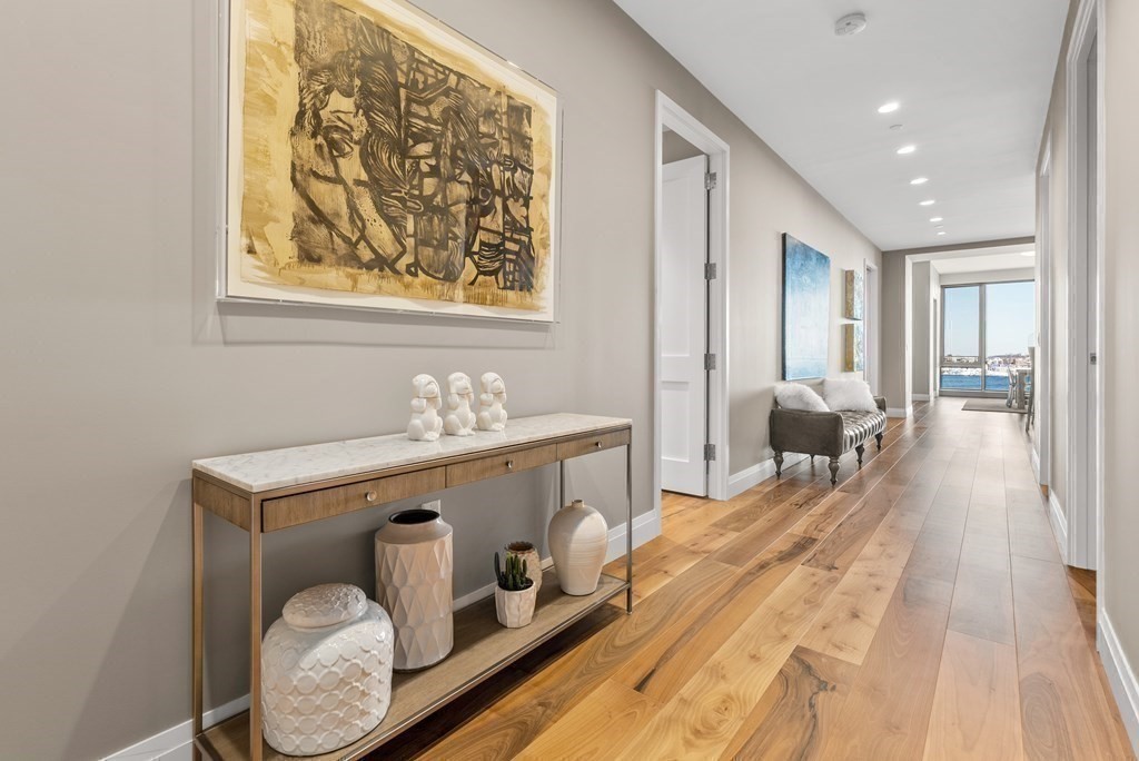 300 Pier 4 Blvd., Unit PHC Boston, MA 02210 - Photo 16 of 42 a spacious bathroom with a toilet sink and mirror