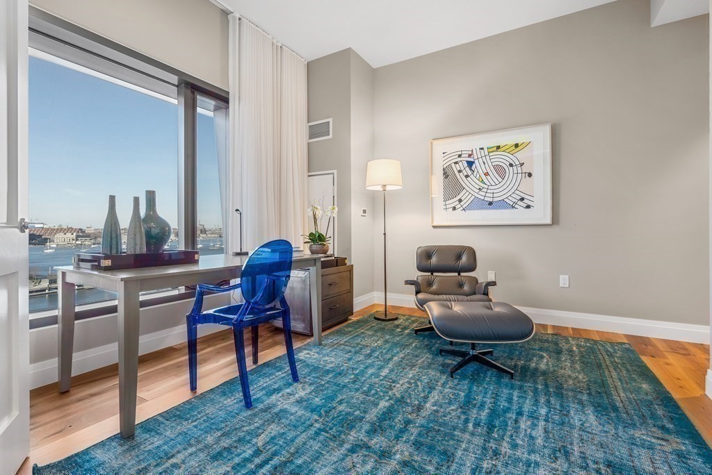 300 Pier 4 Blvd., Unit PHC Boston, MA 02210 - Photo 19 of 42 a living room with furniture and a rug