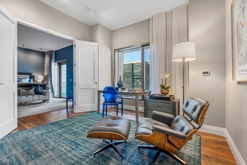 300 Pier 4 Blvd., Unit PHC Boston, MA 02210 - Photo 20 of 42 a living room with furniture and a table