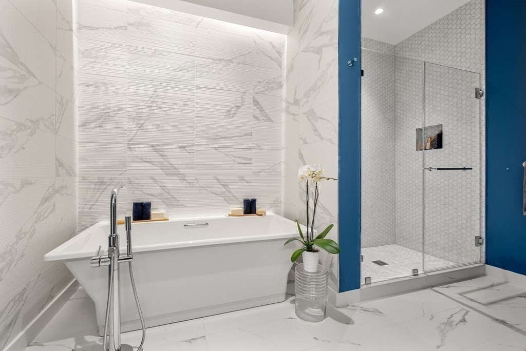 300 Pier 4 Blvd., Unit PHC Boston, MA 02210 - Photo 23 of 42 a bathroom with a sink a mirror and shower