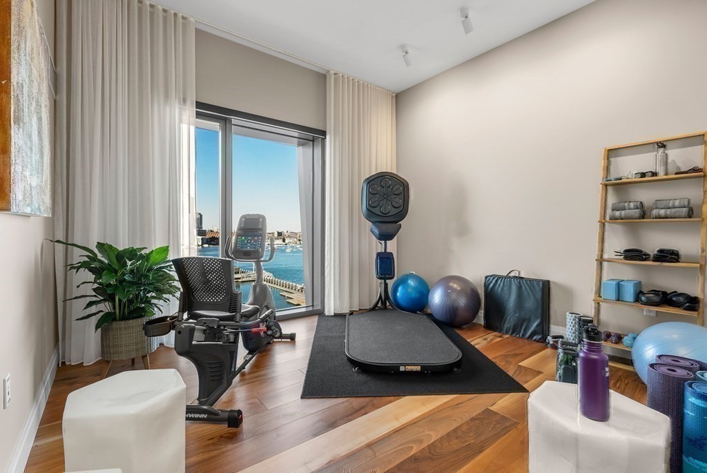 300 Pier 4 Blvd., Unit PHC Boston, MA 02210 - Photo 27 of 42 a living room with furniture and a potted plant