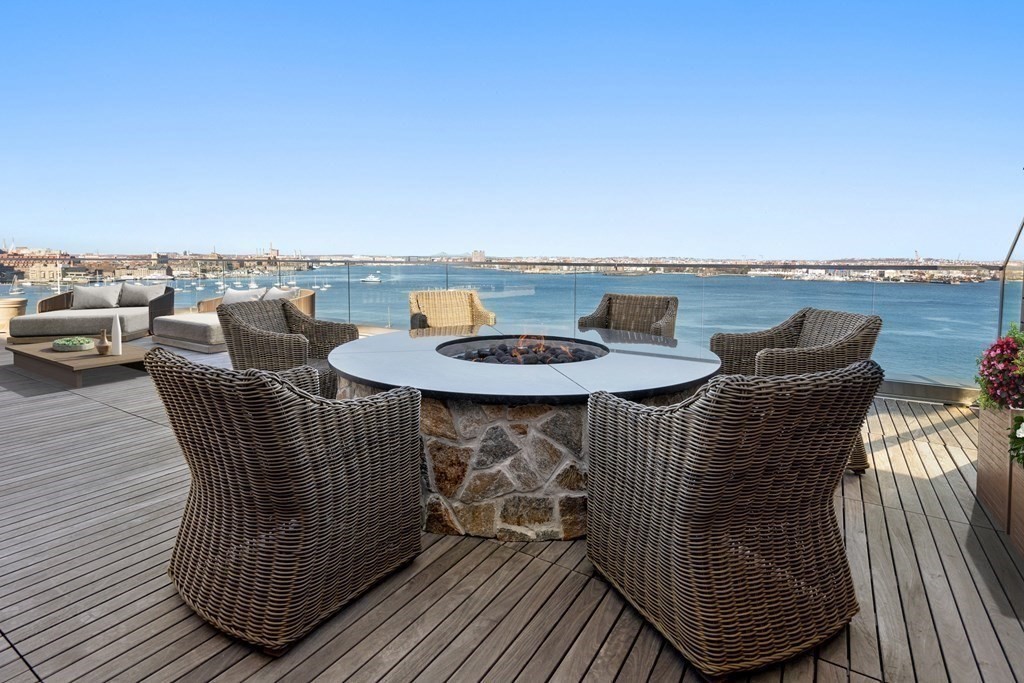 300 Pier 4 Blvd., Unit PHC Boston, MA 02210 - Photo 32 of 42 an outdoor sitting area with furniture and wooden floor