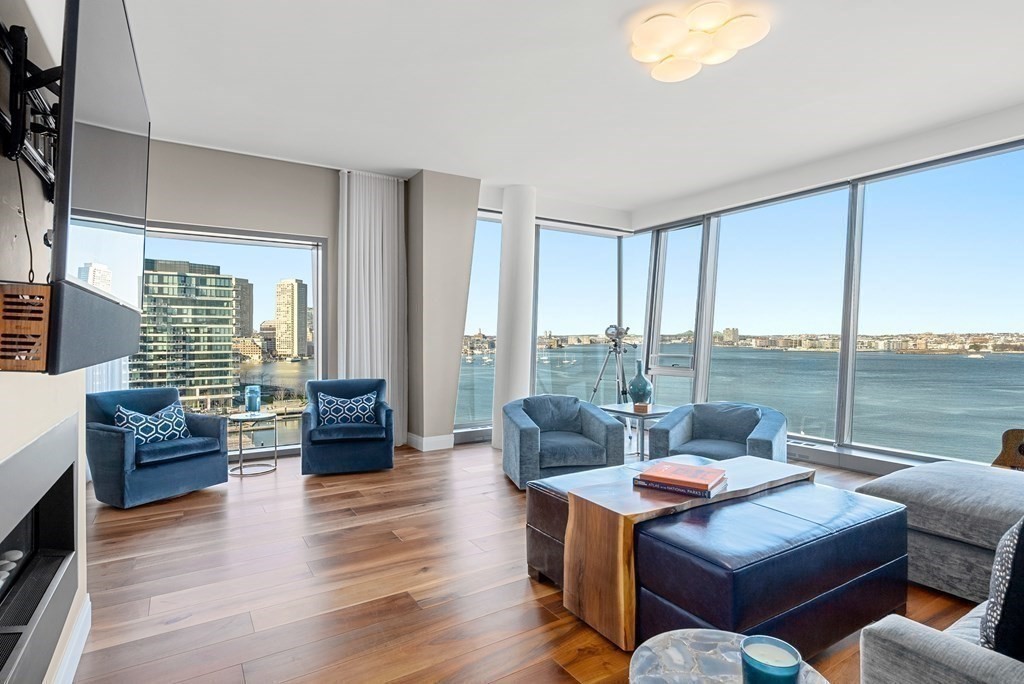 300 Pier 4 Blvd., Unit PHC Boston, MA 02210 - Photo 4 of 42 a living room with furniture and a large window