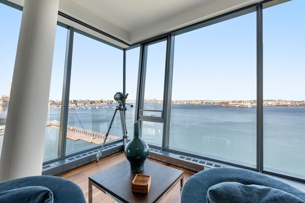 300 Pier 4 Blvd., Unit PHC Boston, MA 02210 - Photo 7 of 42 a living room with a large window