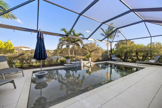 a view of swimming pool with a chair