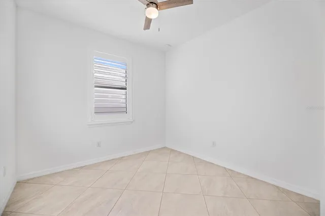 an empty room with a empty space and a window