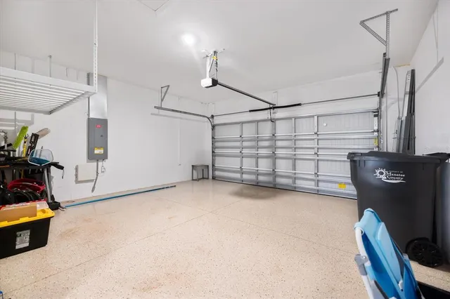 a view of a glass door with a yard from the hallway