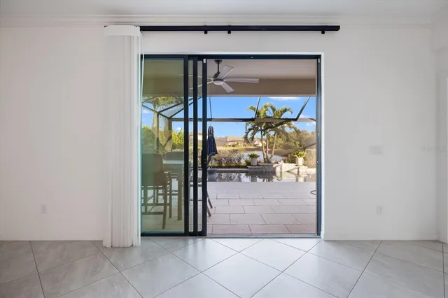 a view of a patio with swimming pool table and chairs