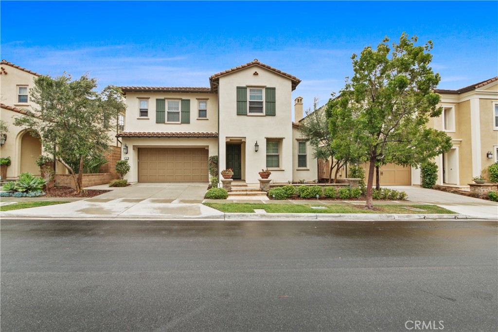64 Hazelton Irvine, CA 92620 - Photo 1 of 23 a front view of a house with a yard
