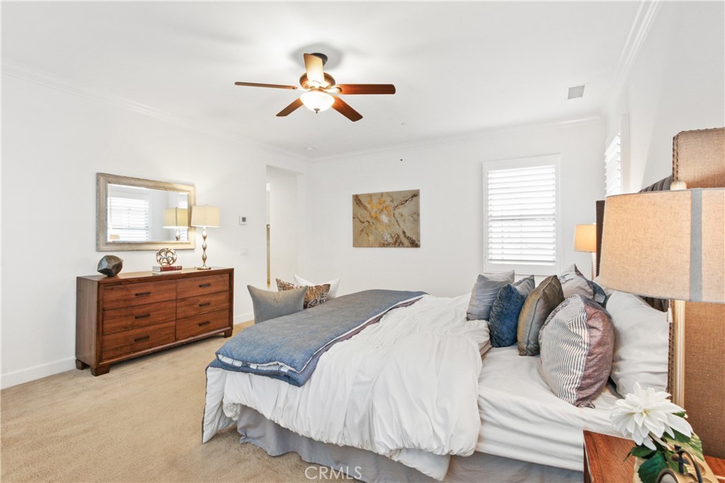 64 Hazelton Irvine, CA 92620 - Photo 13 of 23 a bedroom with a bed and a chandelier