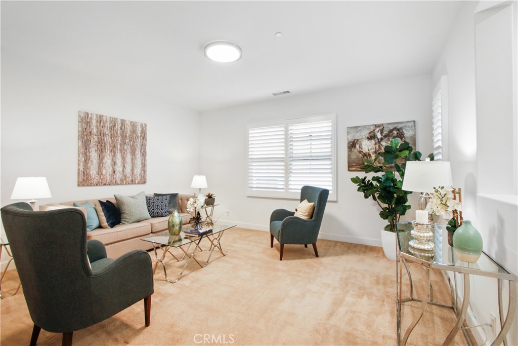 64 Hazelton Irvine, CA 92620 - Photo 16 of 23 a living room with furniture and a potted plant