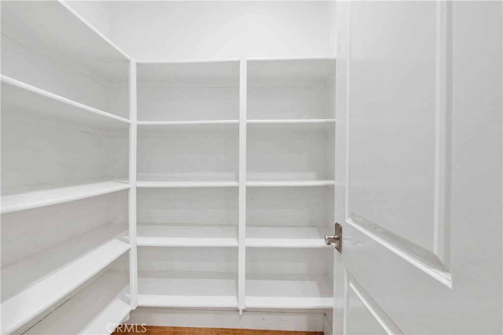 64 Hazelton Irvine, CA 92620 - Photo 9 of 23 a view of walk in closet with empty racks