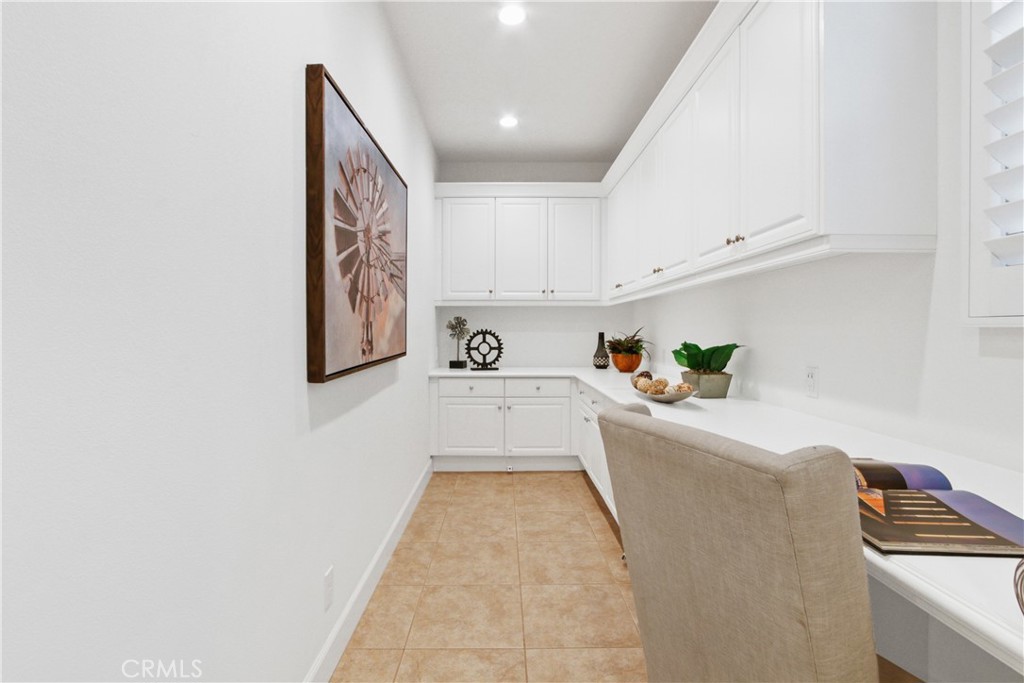 64 Hazelton Irvine, CA 92620 - Photo 10 of 23 a white kitchen with cabinets a sink and wooden floor