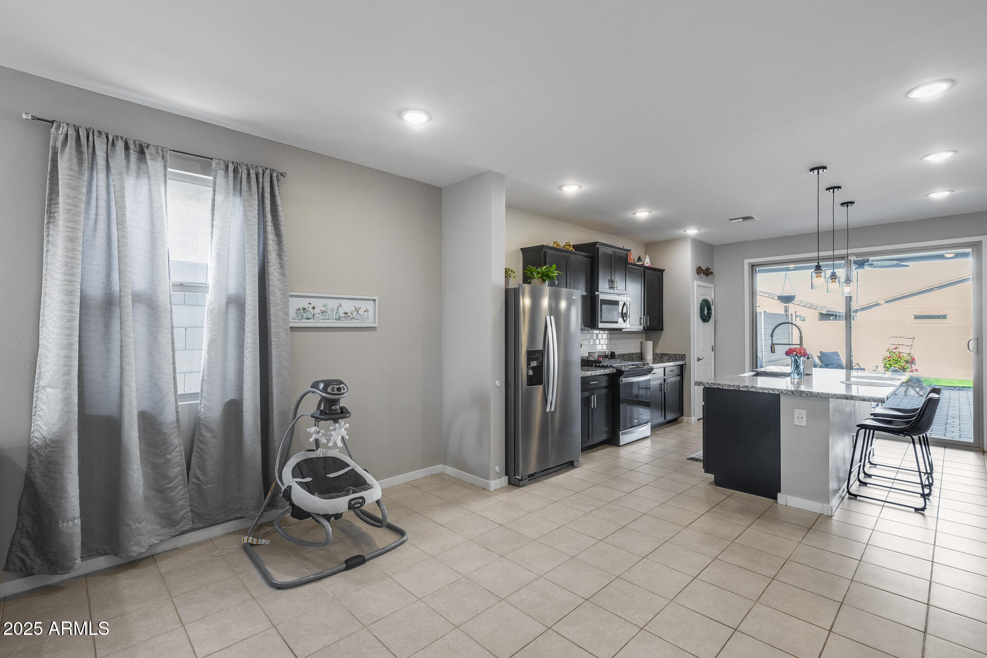 19920 West Rancho Drive Litchfield Park, AZ 85340 - Photo 14 of 49 a view of a room with kitchen appliances and furniture