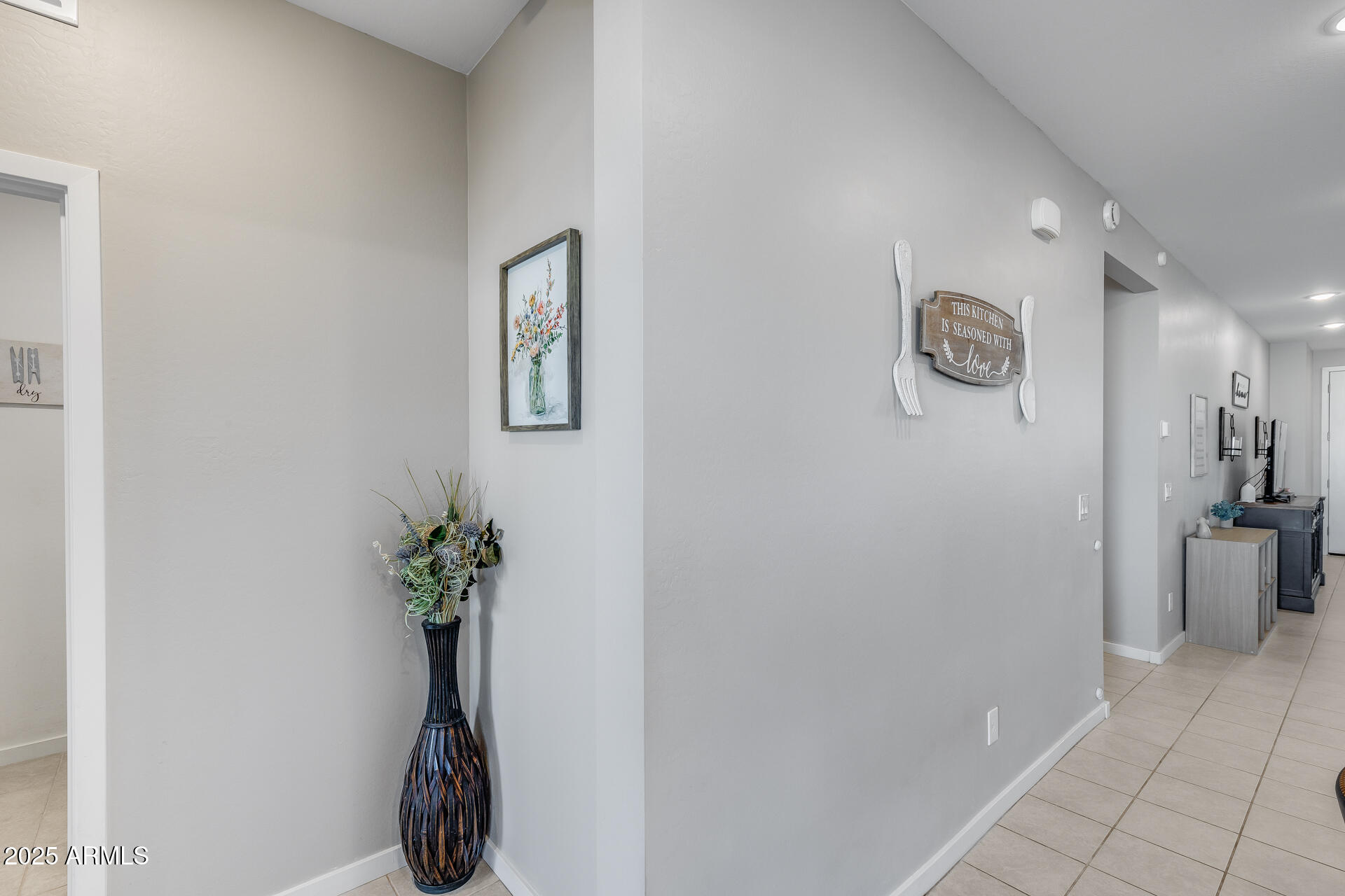 19920 West Rancho Drive Litchfield Park, AZ 85340 - Photo 20 of 49 a view of a hallway with a flower pot