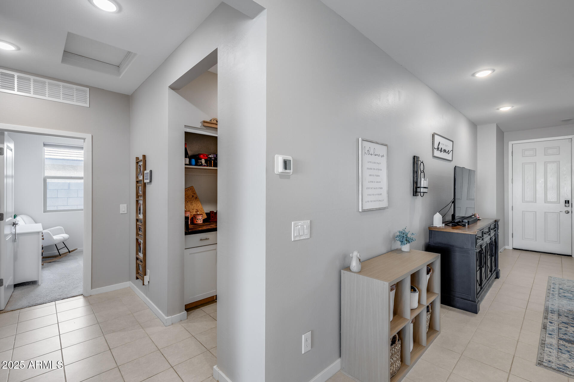 19920 West Rancho Drive Litchfield Park, AZ 85340 - Photo 22 of 49 a view of a hallway with bathroom