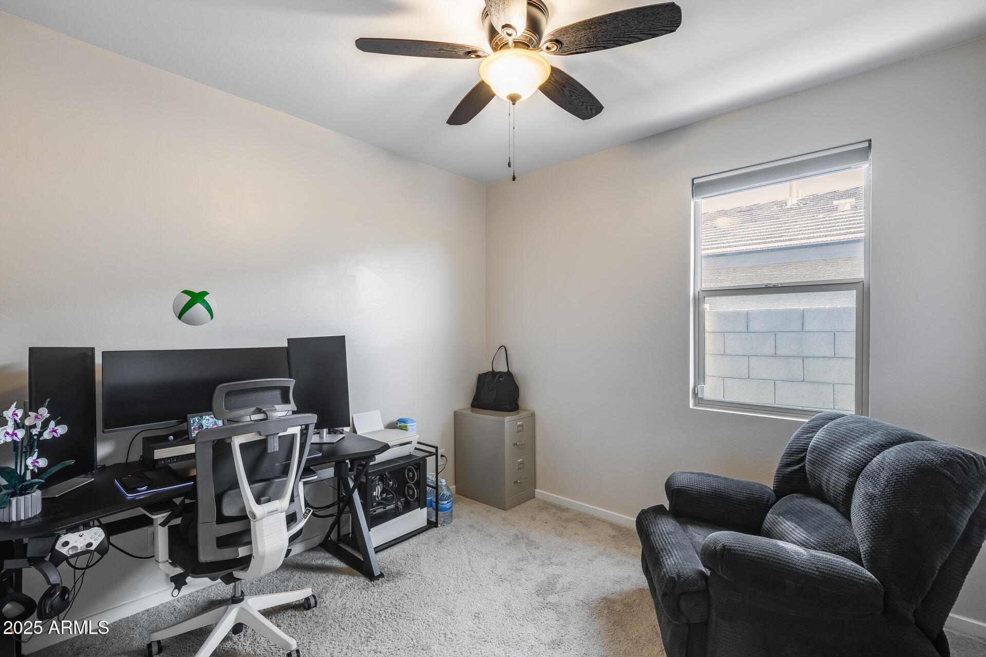 19920 West Rancho Drive Litchfield Park, AZ 85340 - Photo 24 of 49 a view of a workspace with furniture and a window