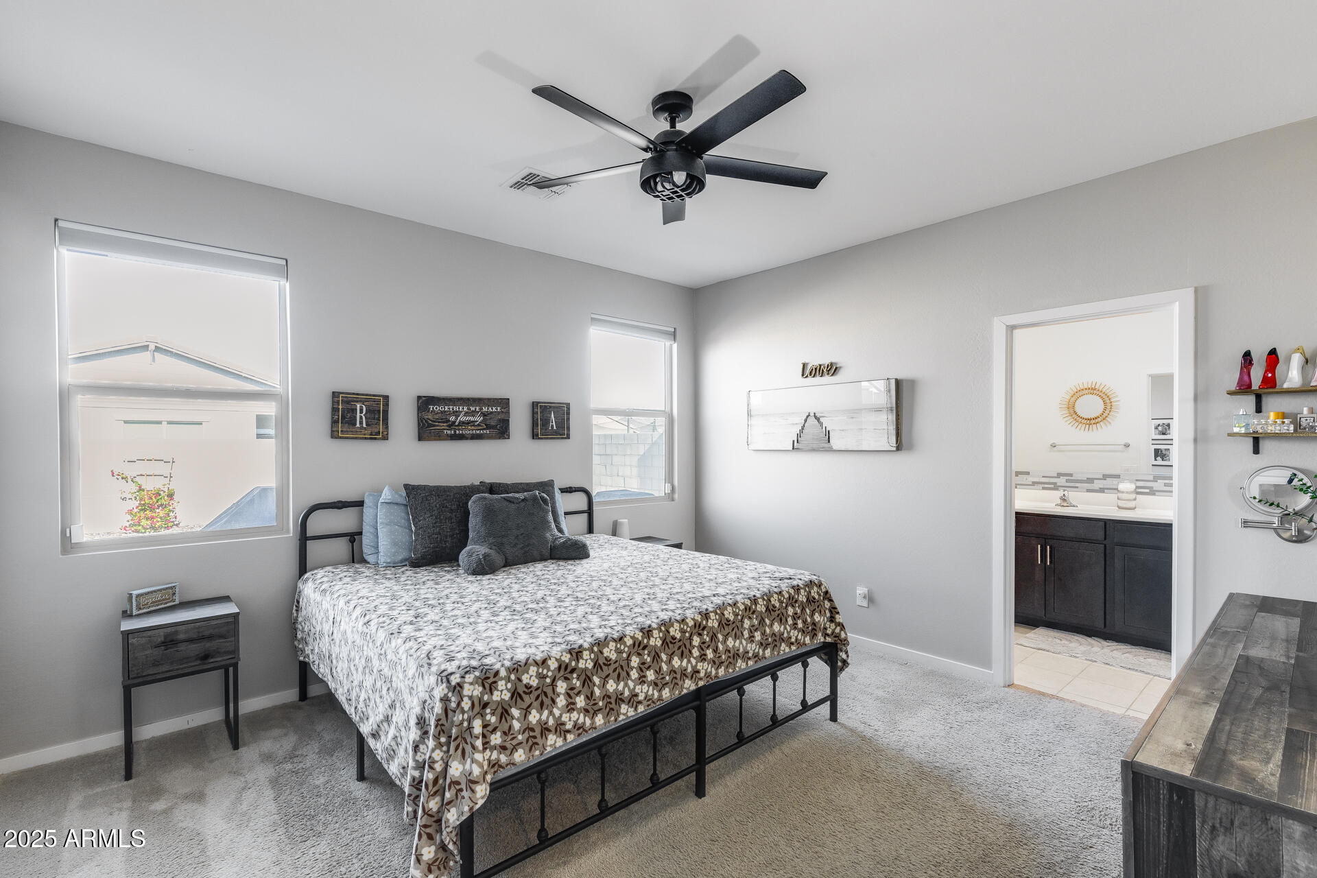 19920 West Rancho Drive Litchfield Park, AZ 85340 - Photo 31 of 49 a bedroom with a large bed and a window