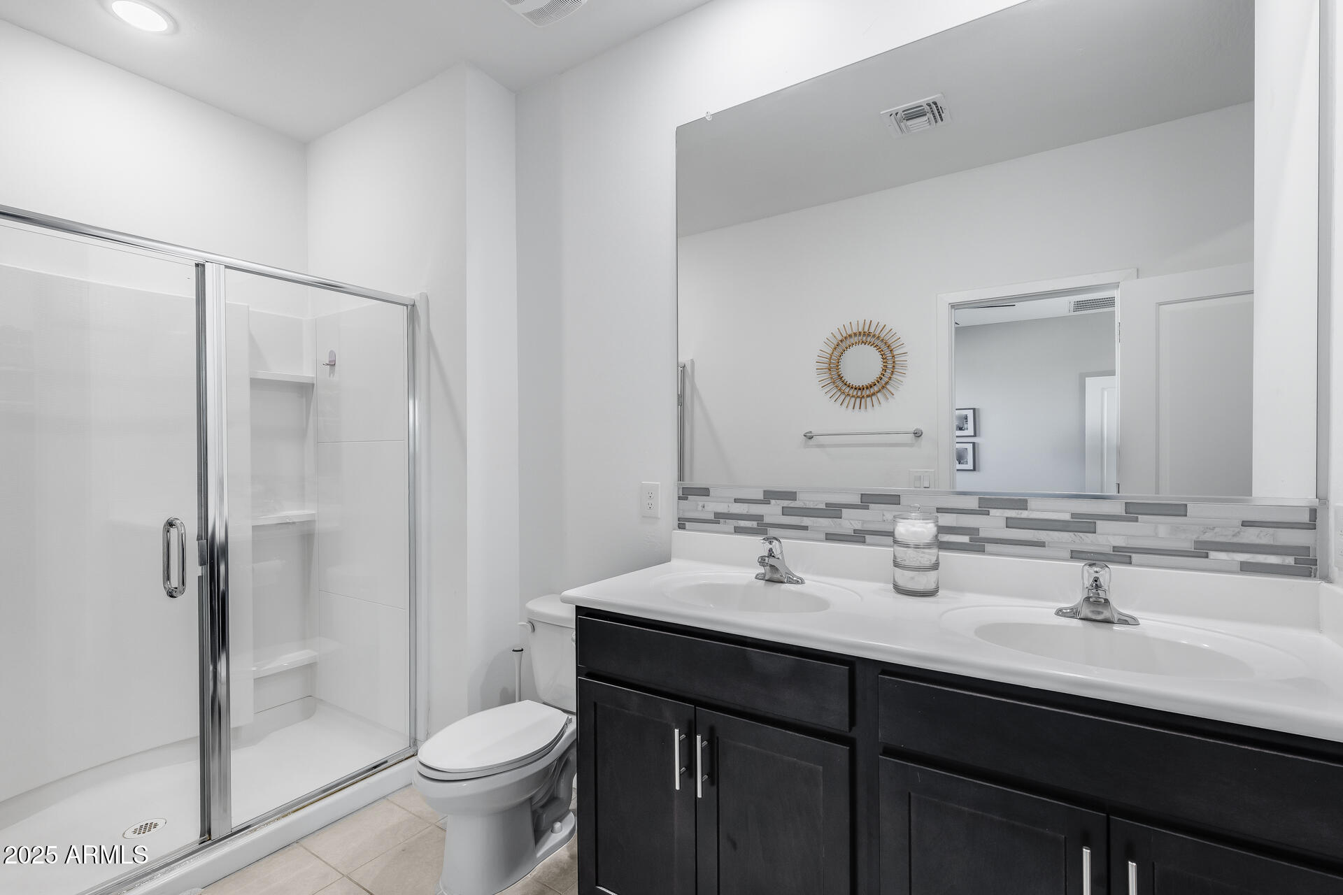 19920 West Rancho Drive Litchfield Park, AZ 85340 - Photo 33 of 49 a bathroom with a sink and a mirror