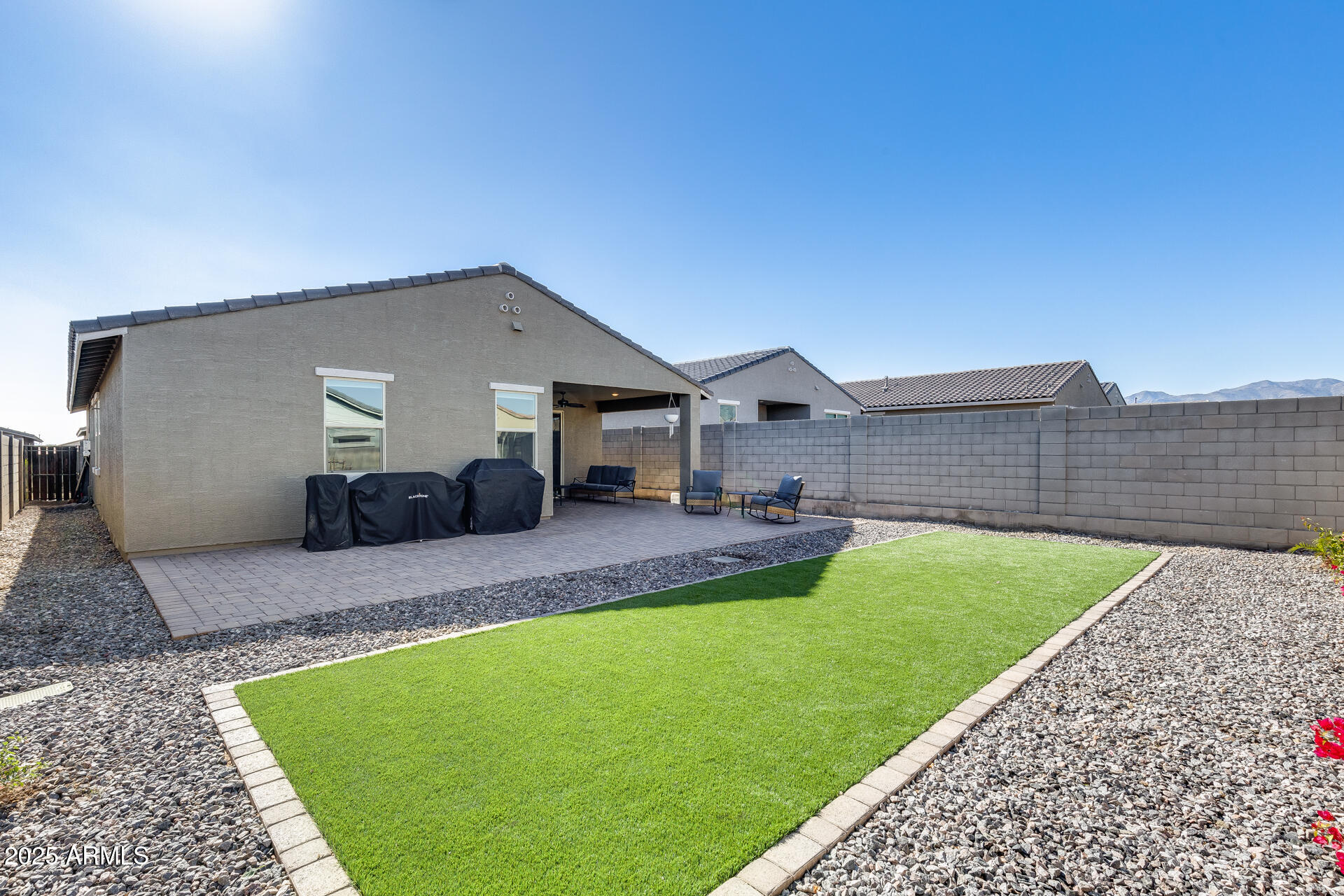 19920 West Rancho Drive Litchfield Park, AZ 85340 - Photo 37 of 49 a backyard of a house with table and chairs