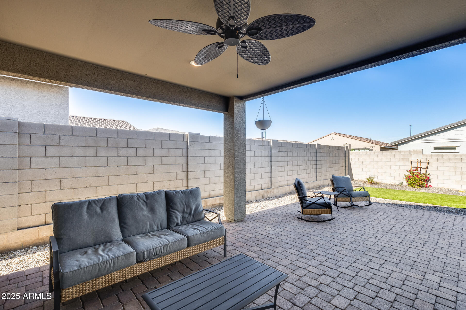 19920 West Rancho Drive Litchfield Park, AZ 85340 - Photo 42 of 49 a living room with furniture and a chandelier