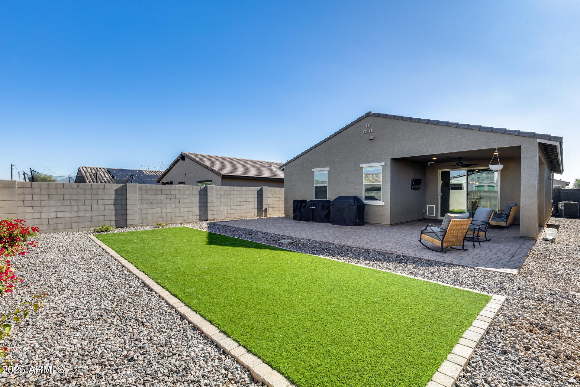 19920 West Rancho Drive Litchfield Park, AZ 85340 - Photo 5 of 49 a view of a house with backyard porch and a garden