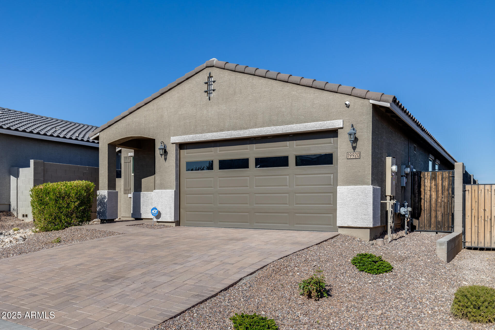 19920 West Rancho Drive Litchfield Park, AZ 85340 - Photo 7 of 49 a front view of a house with garden