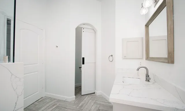 a bathroom with a sink and a mirror