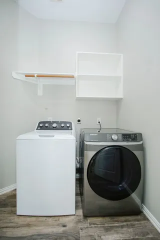 a utility room with washing machine