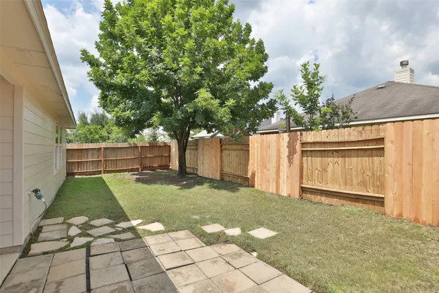 a backyard of a house with lots of green space