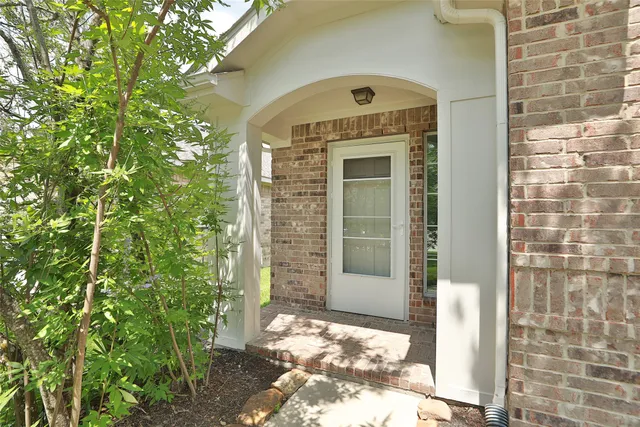 a front view of a house with a glass door