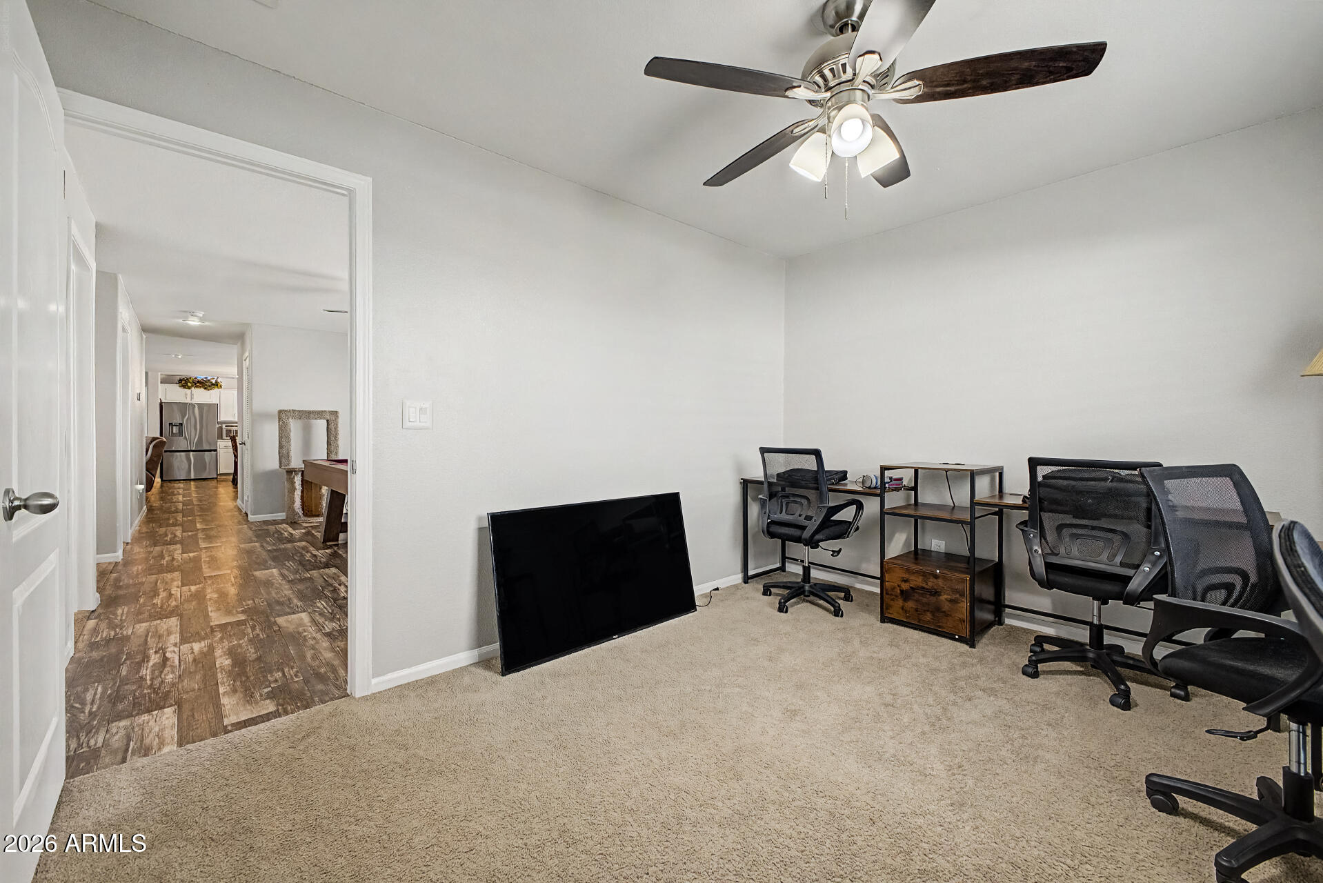 22417 West Dove Valley Road Wittmann, AZ 85361 - Photo 28 of 53 a view of a workspace with furniture