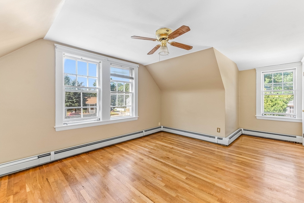 1 Columbia Terrace Dedham, MA 02026 - Photo 12 of 24 a view of an empty room with wooden floor and a window