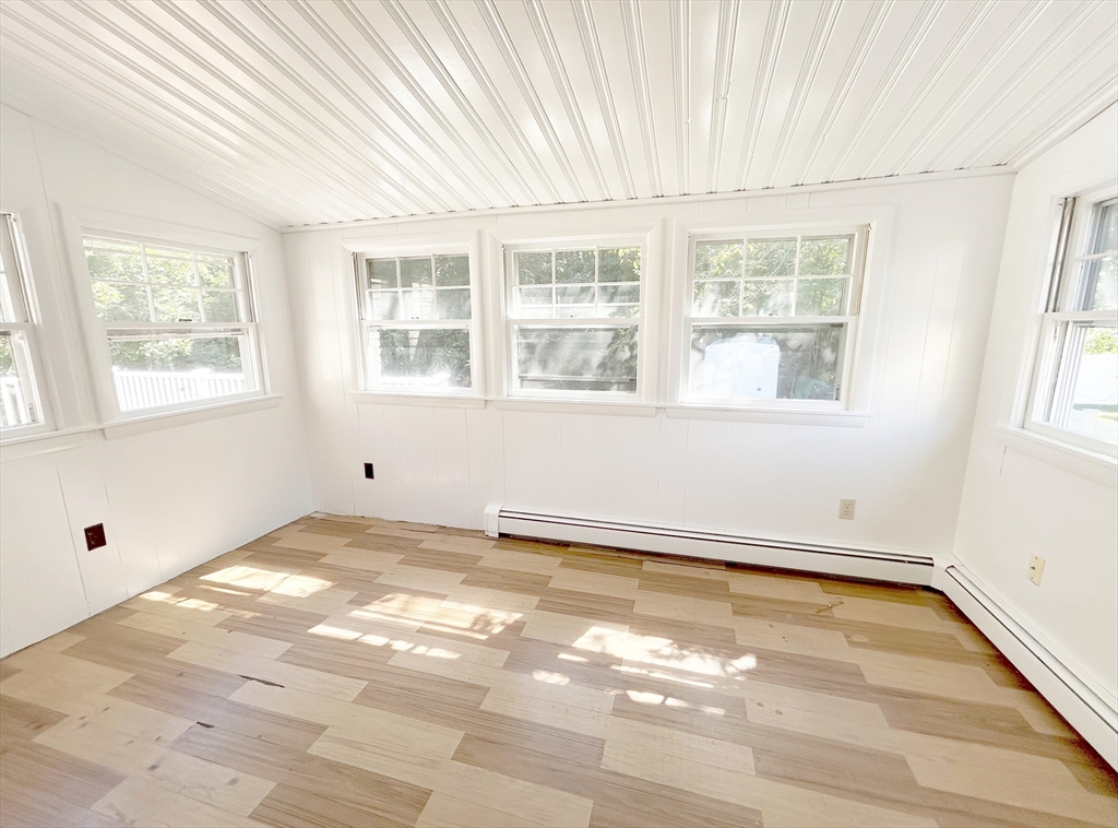 1 Columbia Terrace Dedham, MA 02026 - Photo 16 of 24 an empty room with wooden floor and windows