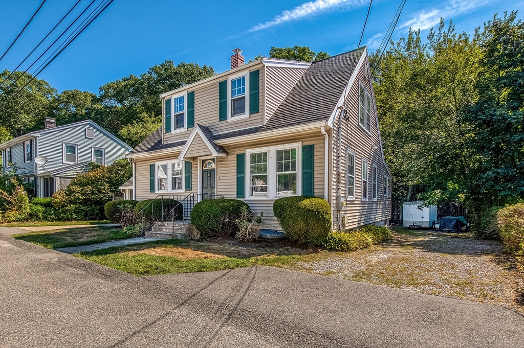 1 Columbia Terrace Dedham, MA 02026 - Photo 2 of 24 a front view of a house with garden