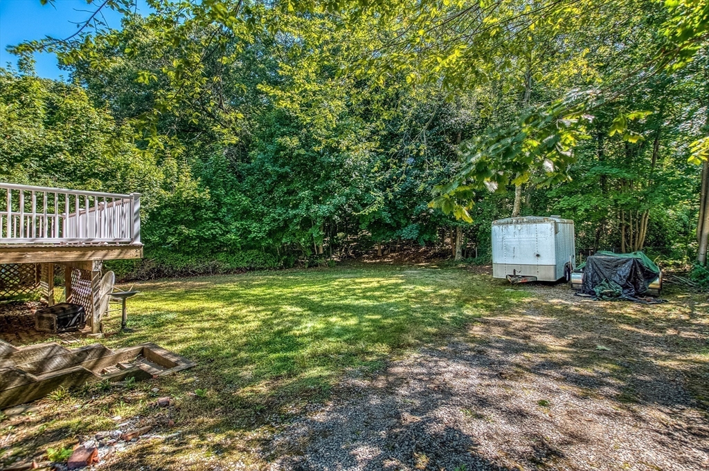 1 Columbia Terrace Dedham, MA 02026 - Photo 23 of 24 a house with tall trees in the background