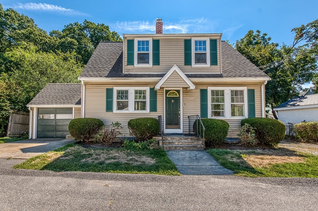 1 Columbia Terrace Dedham, MA 02026 - Photo 3 of 24 a front view of a house with garden and porch