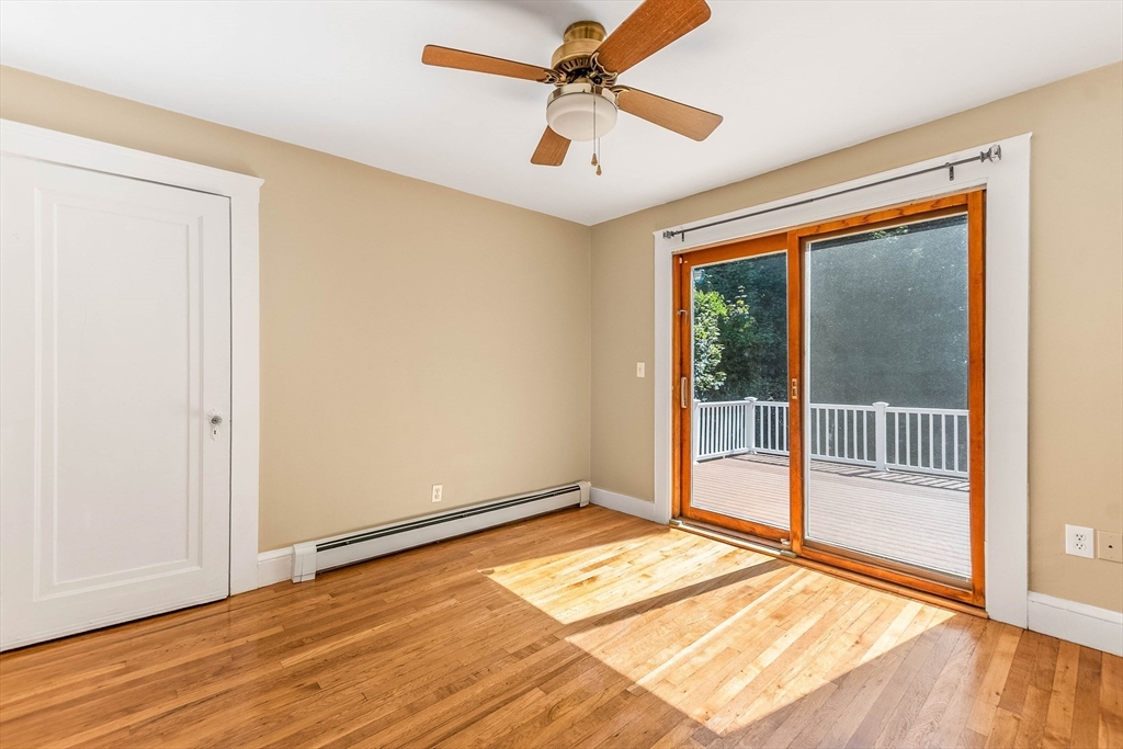1 Columbia Terrace Dedham, MA 02026 - Photo 10 of 24 an empty room with wooden floor and windows