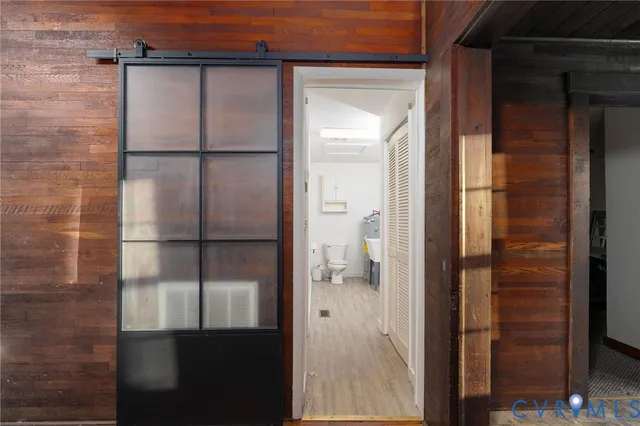 a bathroom with a glass door shower