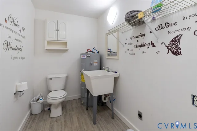 a bathroom with a toilet and a sink
