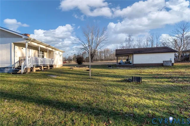a swimming pool with trees in the background