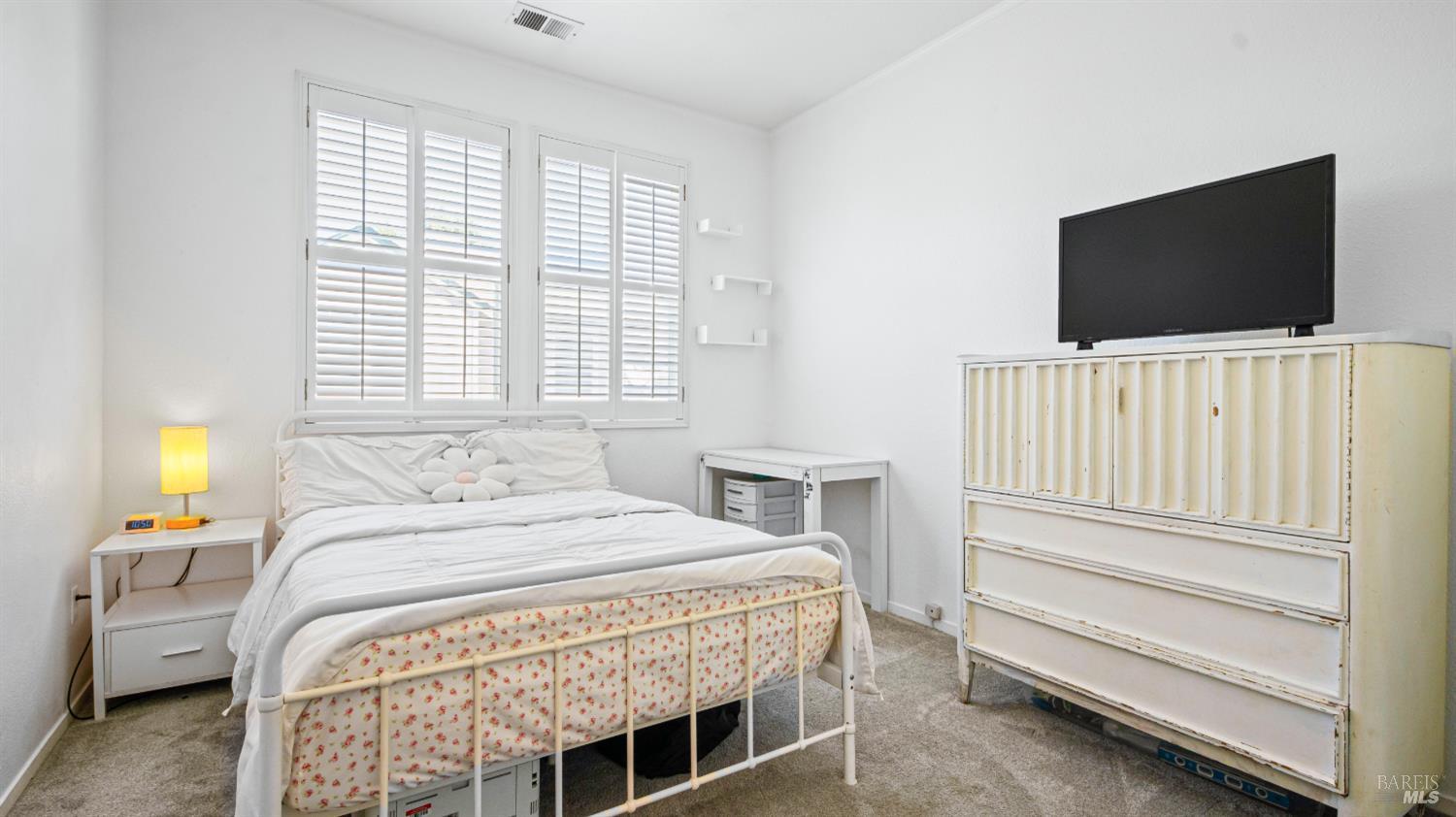 1532 Pinebrook Place Santa Rosa, CA 95403 - Photo 16 of 20 a bedroom with a bed and a flat screen tv