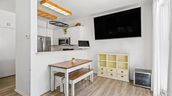 a kitchen with stainless steel appliances a stove microwave and cabinets