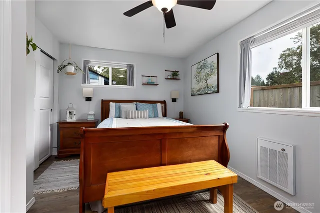 a bedroom with a bed and window