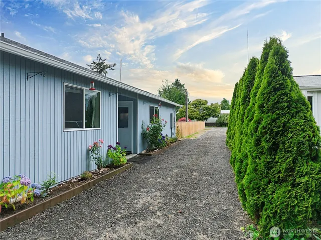 a front view of a house having garden